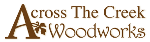 Logo of Cross The Creek Woodworks with a tree and a saw blade design.